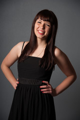 Fototapeta premium Happy woman in black dress