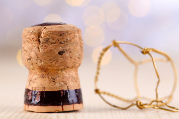 Champagne cork on Christmas lights background