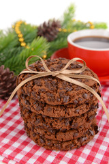 Sweet cookies with cup of tea on table close-up