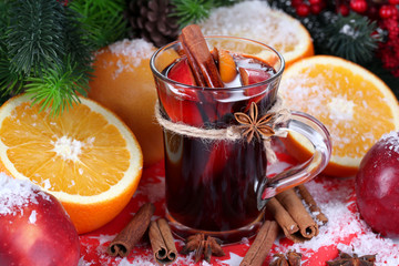Fragrant mulled wine in glass on napkin close-up