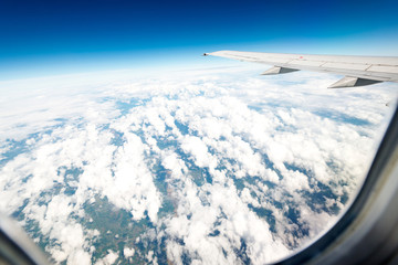 Fototapeta premium Wing aircraft in altitude during flight
