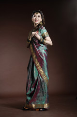Obraz na płótnie Canvas female wearing traditional indian costume posing