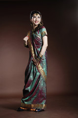 Obraz na płótnie Canvas brunette portrait with traditional costume. Indian style