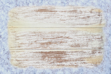 Old wooden background with snow