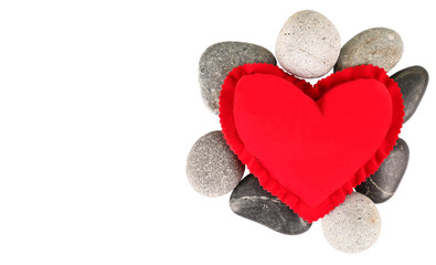 Obraz premium Valentine red heart with zen stones over white background