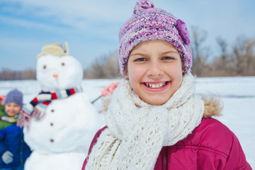 Girl with a snowman