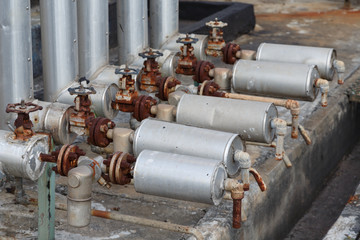 close-up of old steam trap valve on pipe connection