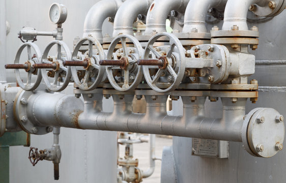 close-up of old gate valve on pipe connection