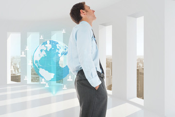 Fototapeta premium Composite image of happy businessman standing with hand in pocke