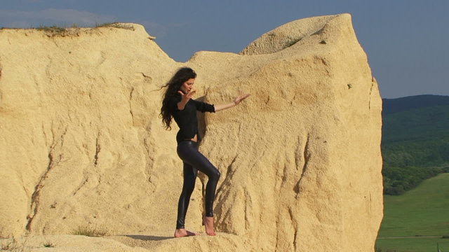 Beautiful model posing for camera in a desert