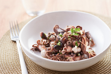Sauteed baby octopus dish