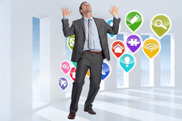 Composite image of businessman posing with arms raised