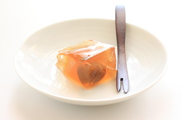 Plum jelly on white background with copy space