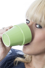 Naklejka premium Young Woman Drinking a Cup of Coffee