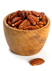 pecan nuts in a wooden bowl