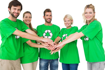People in recycling symbol t-shirts with hands together