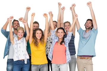 Obraz premium Portrait of casual cheerful people raising hands