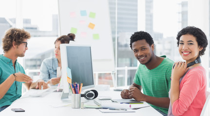 Obraz premium Artists working at desk in creative office