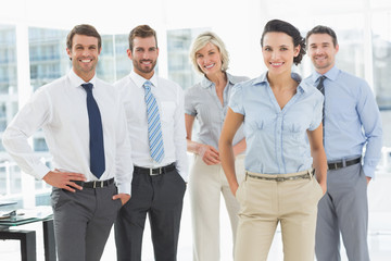 Confident smiling business team in office