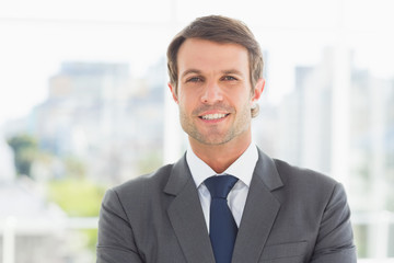 Businessman standing over blurred background outdoors