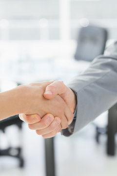 Close-up of shaking hands after business meeting
