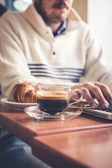multitasking man using tablet, laptop and cellhpone