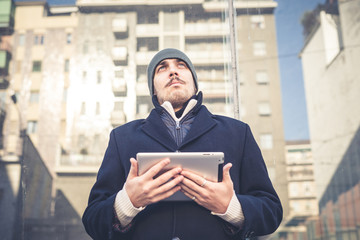 multitasking man using tablet, laptop and cellhpone