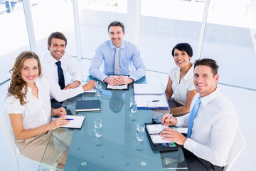 Fototapeta na wymiar Executives sitting around conference table