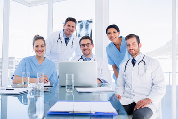 Fototapeta premium Happy medical team using laptop together