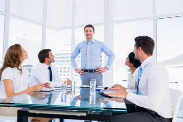 Fototapeta premium Executives sitting around conference table