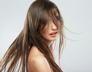 Woman face with hair motion on white background isolated