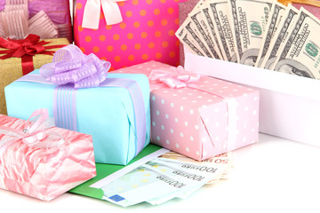 Gift boxes with money close up