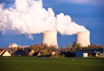 A nuclear power plant located in the countryside close to homes
