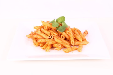 Pasta with pesto rosso decorated with cress