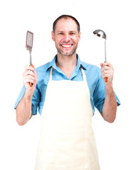 Smiling man cooking in apron isolated on white background