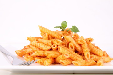 Pasta with pesto rosso decorated with cress