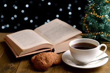 Composition of book with cup of coffee and Christmas