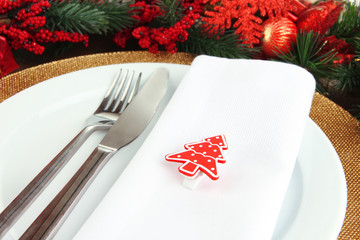 Christmas table setting with festive decorations close up