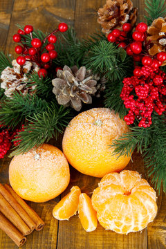 Christmas composition with frosted ripe tangerines
