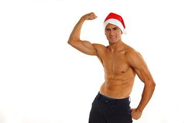 Atletic sexy Santa Claus shows biceps on white backgroung