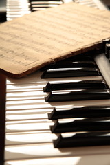Keyboard and old notes. © Andrzej Sowa