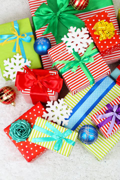 Many colorful presents with luxury ribbons