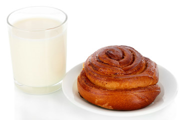 Bread roll and glass of milk isolated on white