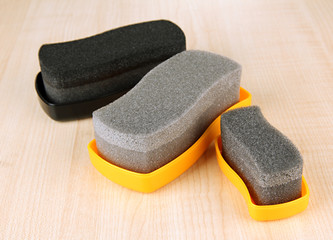 Shoe shine sponges, on wooden background
