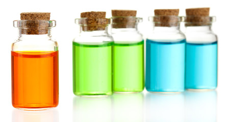 Bottles with basics oils isolated on white