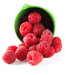 Ripe sweet raspberries in pail, isolated on white