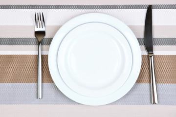 Knife, color plate and fork, on color background