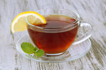 Cup of tea with lemon on table close-up