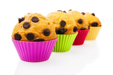 Chocolate chip muffins isolated on white background