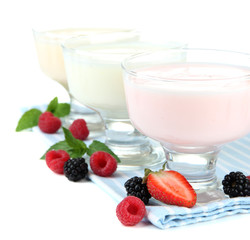 Delicious yogurt with berries isolated on white